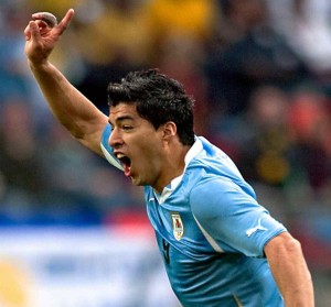 Luis Suarez of Uruguay celebrates  after scoring the opening goal against South Korea